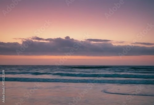 A soft, pastel-colored sunset reflecting over a calm ocean, with gentle waves and a distant horizon.