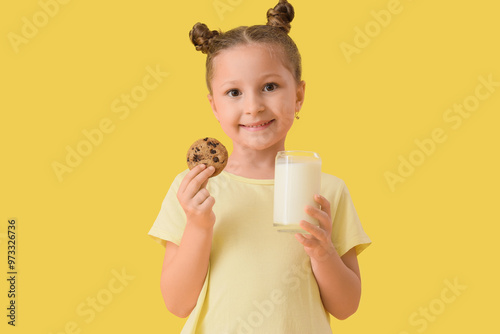 Cute little girl with glass...