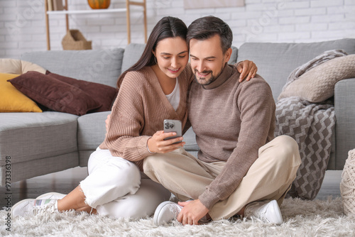 Young couple using mobile p...