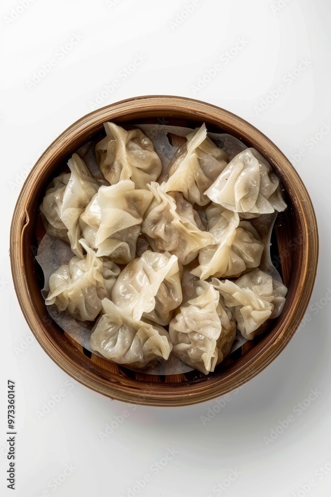 Traditional Chinese dim sum dumplings served in a brown bowl, captured from above against a white Traditional Chinese dim sum dumplings served in a brown bowl, captured from above against a white
