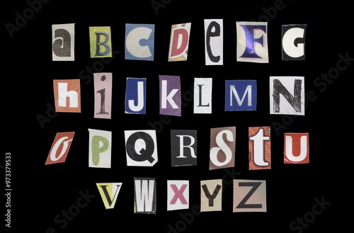 Set of cut-out English alphabet from magazines on a black background, retro y2k style photo