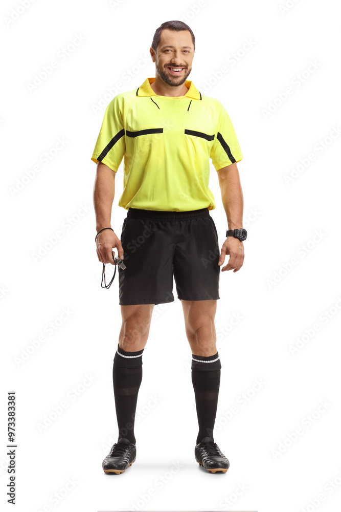 Football referee holding a whistle and smiling Football referee holding a whistle and smiling