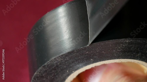 Roll of black electrical tape for electronics repair