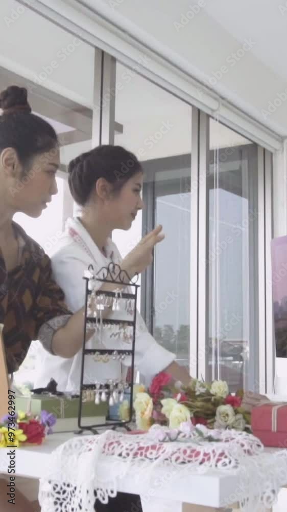 Future bride customer talking with wedding store shopkeeper to buy wedding dress and accessories for her upcoming wedding ceremony. Future bride customer talking with wedding store shopkeeper to buy wedding dress and accessories for her upcoming wedding ceremony.