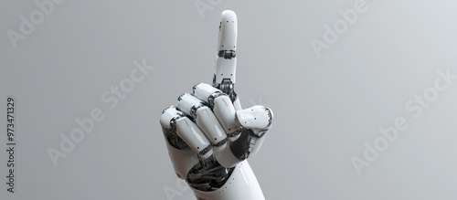 Robotic hand making a middle finger gesture against a gray backdrop symbolizing themes of AI dominance and technological singularity photo