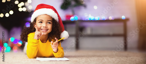 Idea. Cute african girl has great thought about Christmas gift, free space