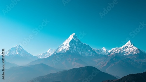 Wallpaper Mural Majestic snow-capped mountain range under clear blue sky, showcasing the breathtaking beauty of towering peaks, pristine wilderness, and serene natural landscape. High resolution, perfect for nature,  Torontodigital.ca