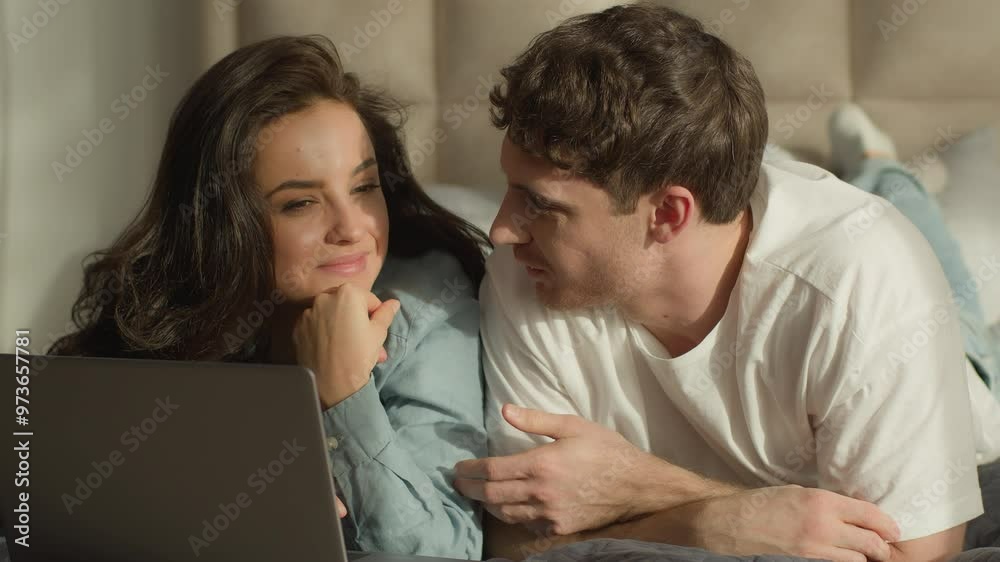 Man woman boyfriend girlfriend female male lying on bed bedroom laptop watching movie cinema couple online computer tech cyberspace girl guy together date talk chat relationship home weekend discuss Man woman boyfriend girlfriend female male lying on bed bedroom laptop watching movie cinema couple online computer tech cyberspace girl guy together date talk chat relationship home weekend discuss