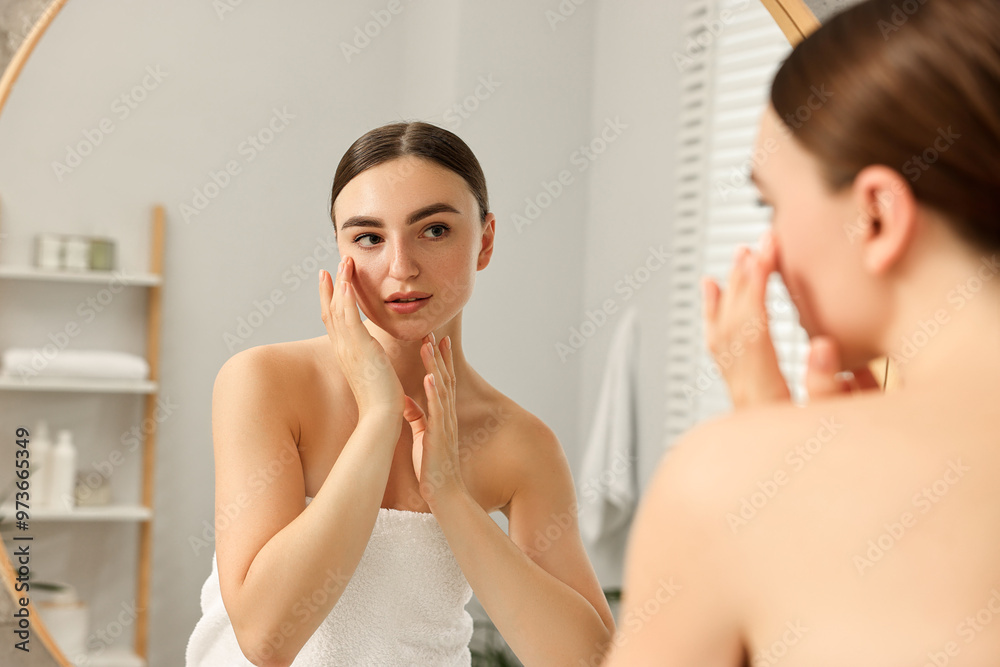 Face massage. Beautiful young woman with healthy skin near mirror at home Face massage. Beautiful young woman with healthy skin near mirror at home