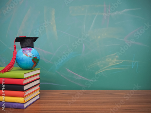 Student creative desktop , earth globe with graduation hat on hardcover book. Copy space for text, Back to school, Education concept