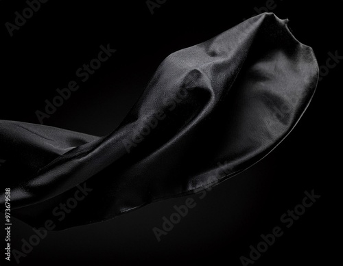 Abstract black fabric flying on a black background, creating a dramatic contrast, generative ai photo