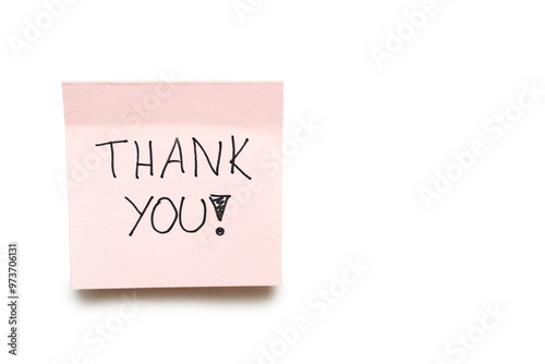 Hand writing THANK YOU on pink sticky note isolated on white background with clipping path.