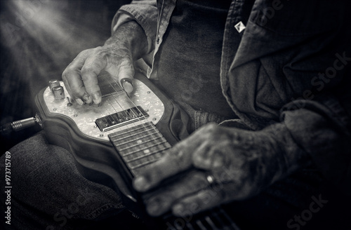 Lap Steel Guitar with Musician playing with a slide and finger picks