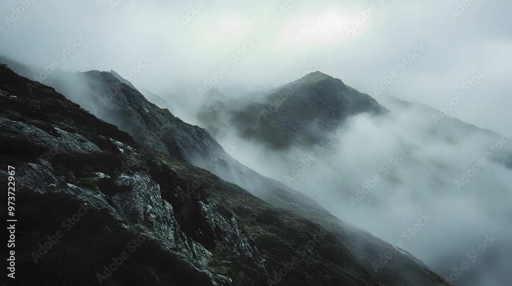 Misty Mountain Peaks with a Dramatic, Fog-Filled Sky Misty Mountain Peaks with a Dramatic, Fog-Filled Sky