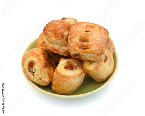 Sweet braided puff pastry isolated or pate feuilletee on white background top view. Fresh phyllo pastry with jam inside close up - Image photo