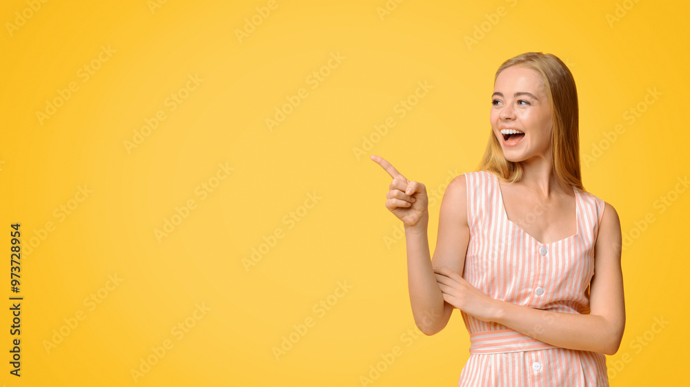 Great offer. Joyful young woman in summer dress pointing aside at copy space on yellow background, demonstrating cool promo Great offer. Joyful young woman in summer dress pointing aside at copy space on yellow background, demonstrating cool promo