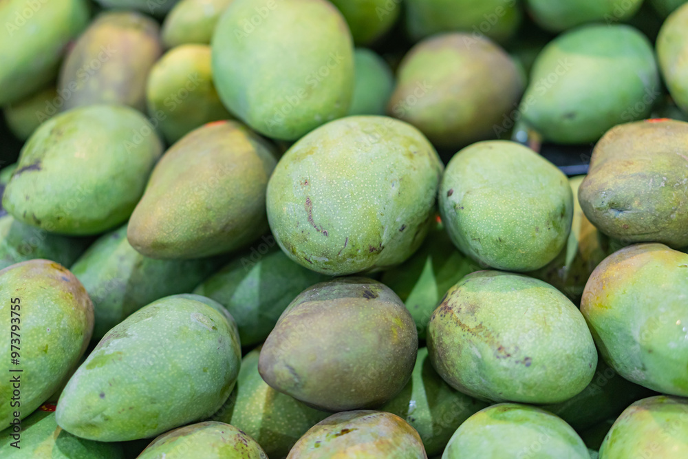 Fresh Green Mangoes in a Market Fresh Green Mangoes in a Market