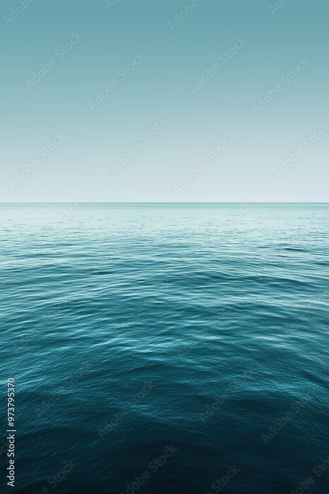 Ocean horizon stretching into distance under blue sky