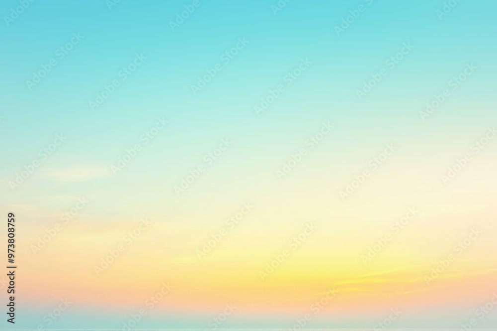 Obraz premium Colorful pastel sky transforming into golden yellow at sunset