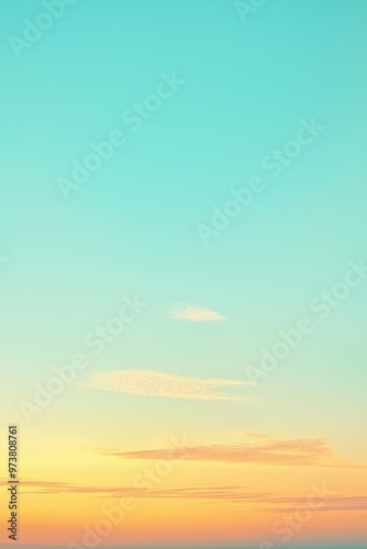 Turquoise sky turning orange and yellow during sunset