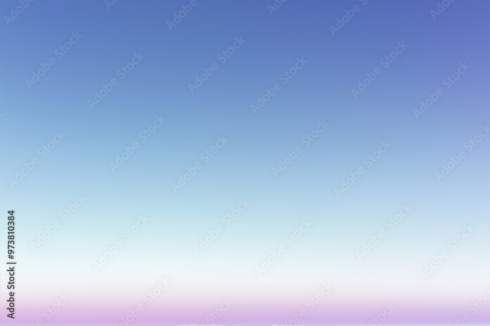 Blue sky fading to pink and white on the horizon