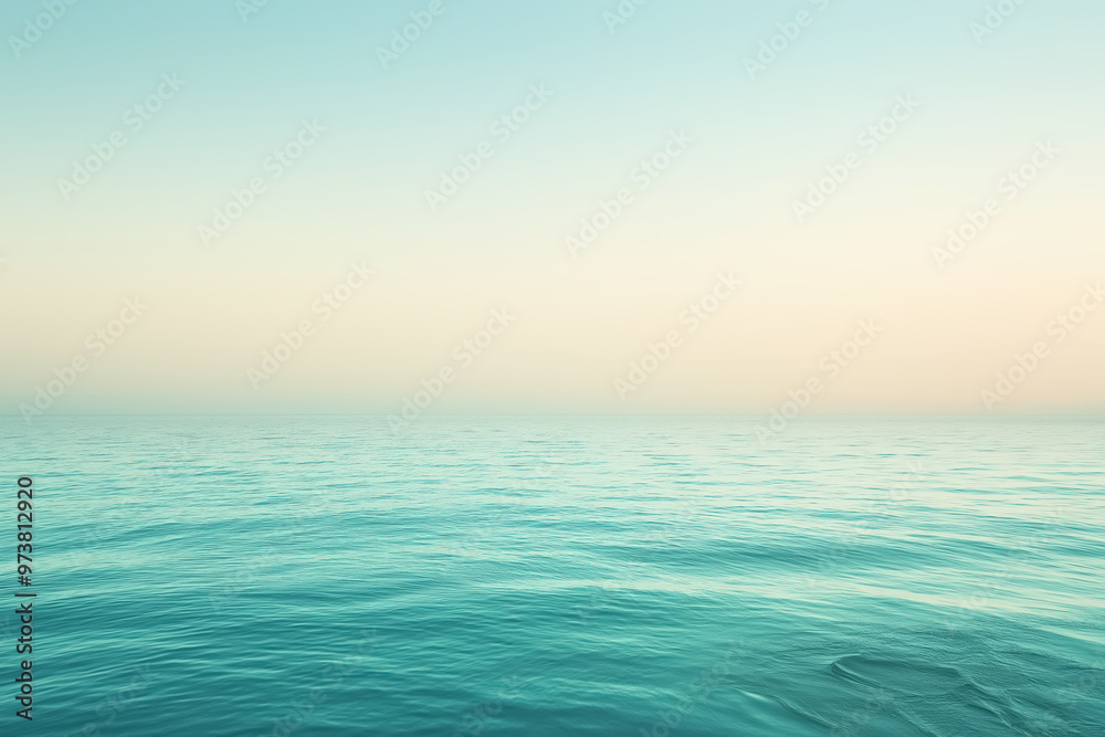 Obraz premium Calm ocean water meeting pastel sky at horizon