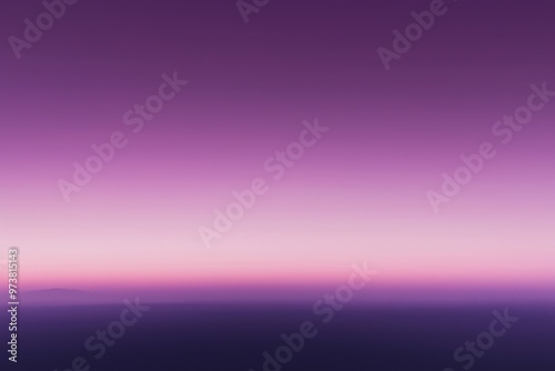 Purple sunset fading into night over misty landscape