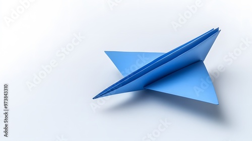 Free Download A Blue Paper Airplane Folded with Sharp Lines and a Pointed Nose - GFXLoad