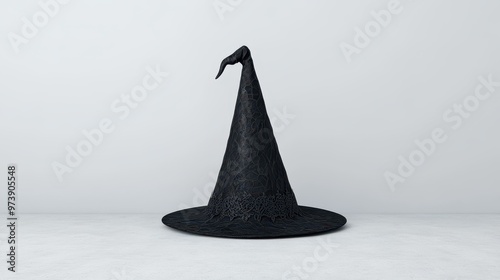 An enchanting black witch hat with lace details, ideal for Halloween or fantasythemed photo shoots on a clean backdrop. photo