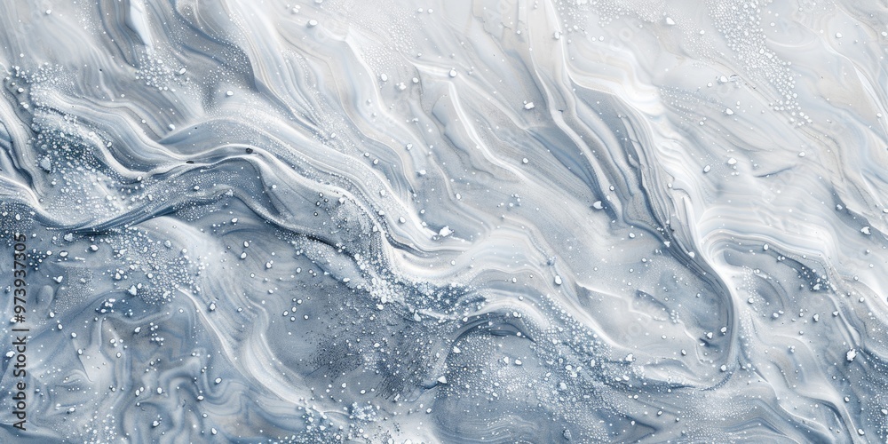 Swirling snow patterns emerge on a blank surface as the wind blows, sparkling with ice crystals that produce a distinct natural texture in the serene winter scenery. Swirling snow patterns emerge on a blank surface as the wind blows, sparkling with ice crystals that produce a distinct natural texture in the serene winter scenery.