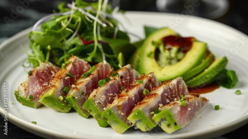 Seared Tuna with Avocado and Greens: Seared Tuna with Avocado and Greens: A tantalizingly fresh and vibrant dish, featuring perfectly seared tuna slices nestled atop a bed of crisp greens. photo