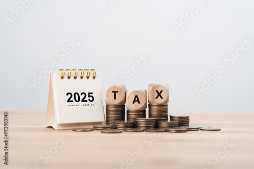 2025 Calendar and Word Tax on coin. Business tax management concept. Tax deduction planning and calculation tax return from government.  personal taxes report. Financial research, Taxation season