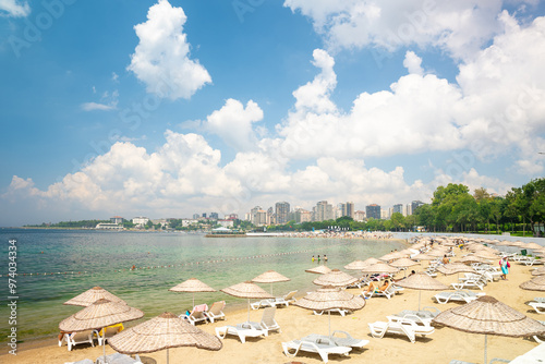 Photography Istanbul, Turkey - July 7, 2024: People resting on the Caddebostan sandy beach
