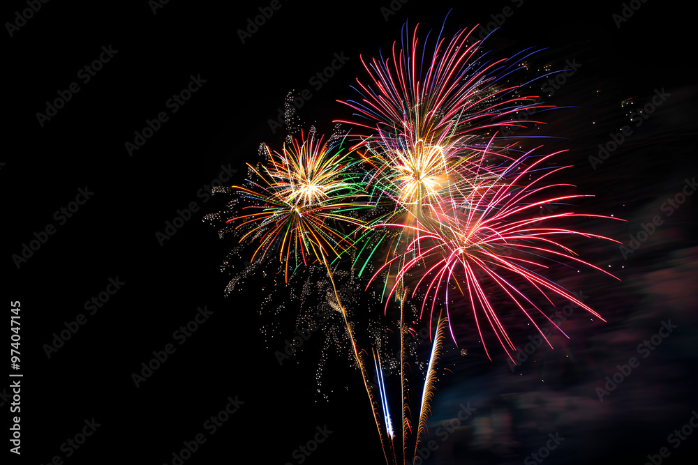 Beautiful fireworks in the night sky, creating a joyous atmosphere. Beautiful fireworks in the night sky, creating a joyous atmosphere.