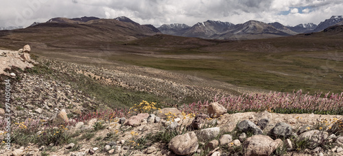 Clouds and curvilinear landscapein in the natural park of Deosai photo