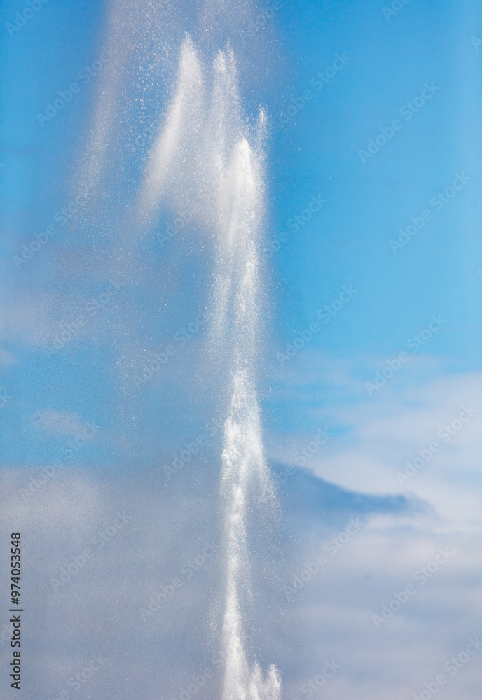 Water splashes from a fountain against a blue sky Water splashes from a fountain against a blue sky