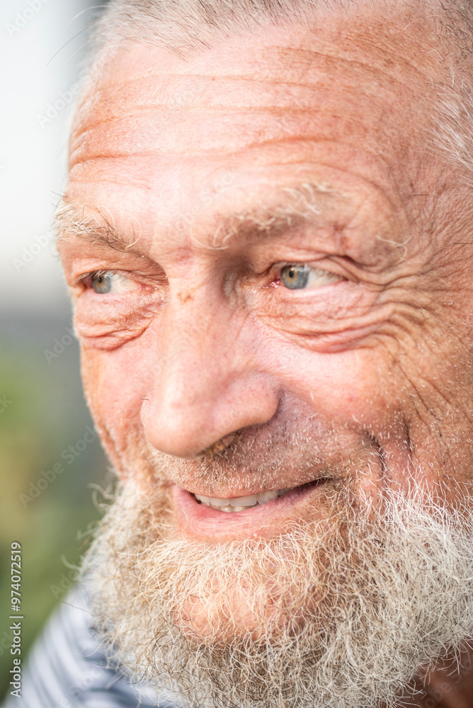 Portrait of an elderly man smiling happily in the park, enjoying his free time outdoors. A mature gentleman with a serene expression, reflecting a healthy and joyful lifestyle, embodying the essence Portrait of an elderly man smiling happily in the park, enjoying his free time outdoors. A mature gentleman with a serene expression, reflecting a healthy and joyful lifestyle, embodying the essence