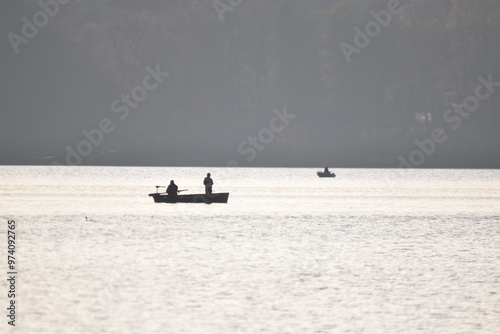 Fishermen catching fish from a boat