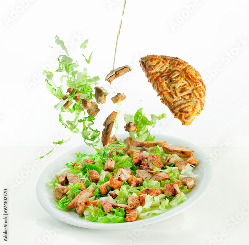 Caesar salad with all the toppings, Caesar sauce, lettuce, grilled chicken breast and taboon bread photo