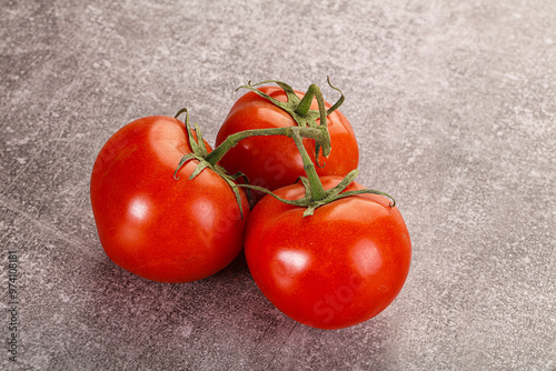 Sweet ripe tomatoes on the branch