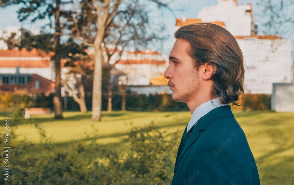 Young stylish man in business suit is walking on the street. Young Confident businessman walks in the city. Stylish White man with brown hair is walking in the city on the summer. Young stylish man in business suit is walking on the street. Young Confident businessman walks in the city. Stylish White man with brown hair is walking in the city on the summer.