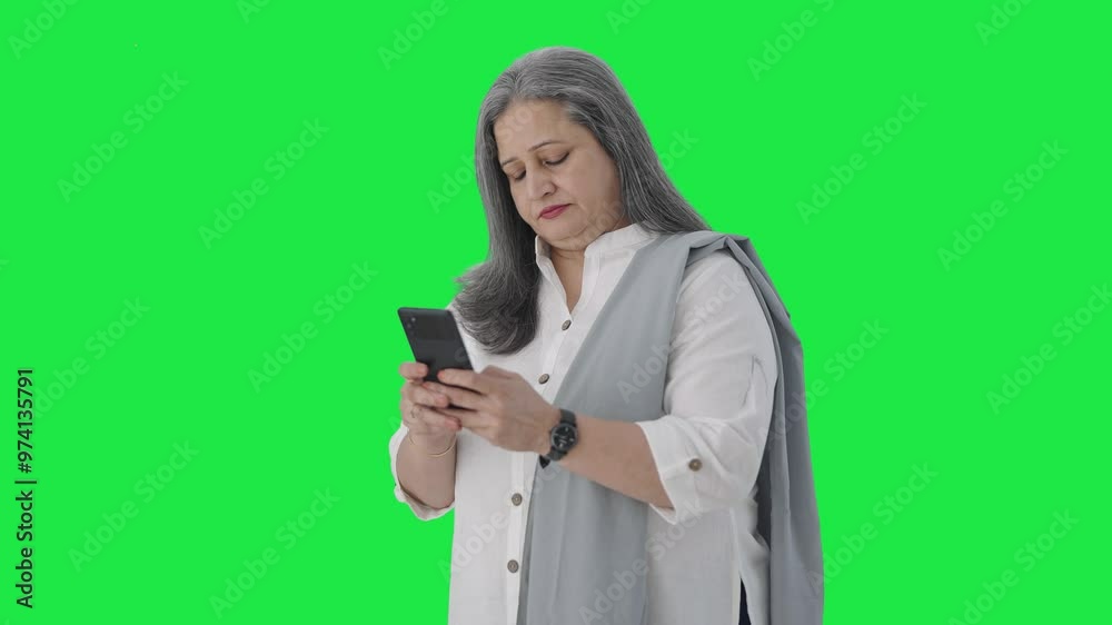Indian senior businesswoman chatting on phone Green screen Indian senior businesswoman chatting on phone Green screen