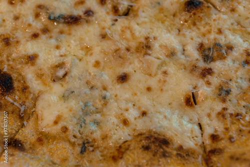 Close-up of a Delicious Golden Brown Four Cheese Pizza with Rustic Crust and Melted Toppings