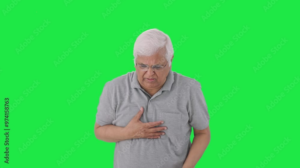 Sick Indian old man suffering from cold and cough Green screen Sick Indian old man suffering from cold and cough Green screen