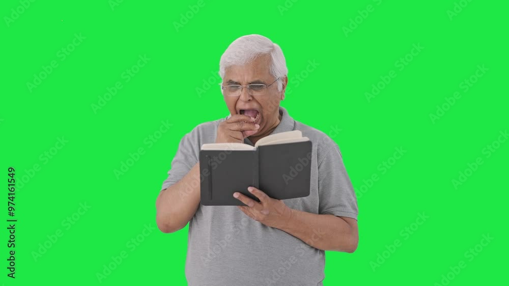 Sleepy Indian old man reading a book Green screen Sleepy Indian old man reading a book Green screen