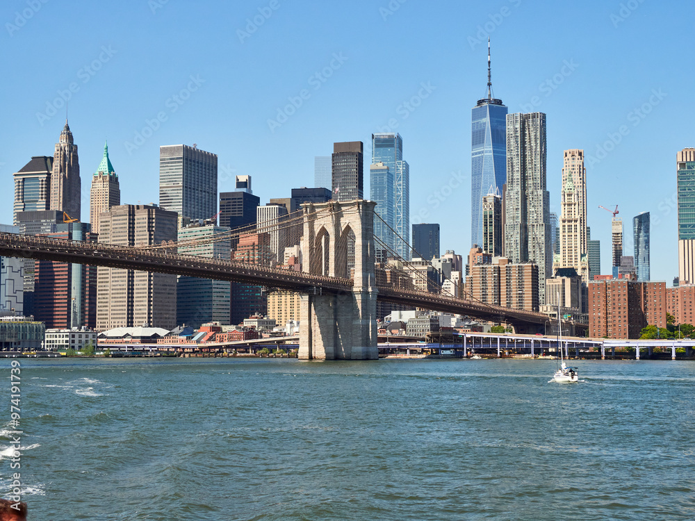 Obraz premium Brooklyn Bridge, connects the boroughs of Manhattan and Brooklyn in New York City. It is a historic symbol of New York and a fundamental part of the city, as it crosses the East River connecting Manha