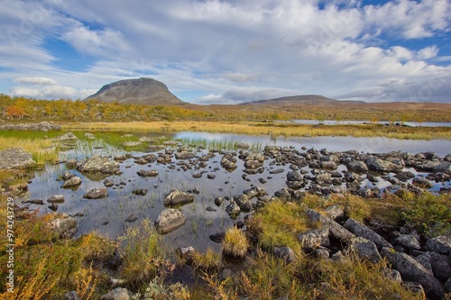 Autumn view of Saana Fell from Tsahkal Lake near Kilpisjarvi village, Lapland, Finland