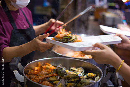 People hand take buffet food in hotel restuarant