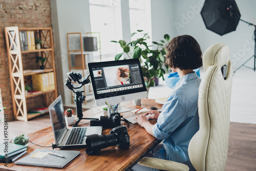 Photo of sweet charming camera woman wear shirt retouching photo modern gadget indoors workplace workstation