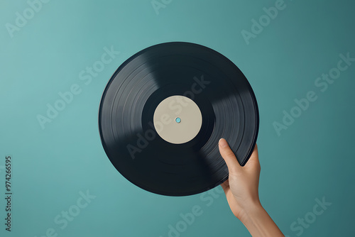 Hand holding a vinyl record with a record player, featuring retro and vintage music elements